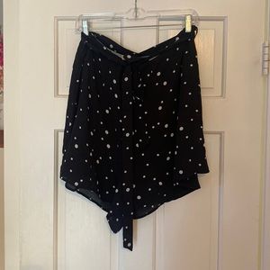 black flowy polka dot shorts with belt